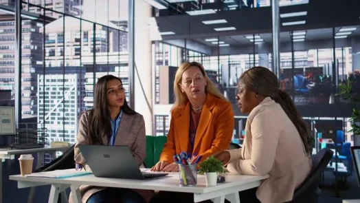 This image illustrates consultants discussing AI Act and ethics, focused on creating responsible and compliant AI governance.