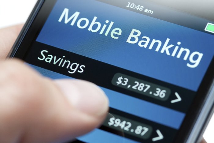 Mobile banking screen displaying a savings account, illustrating mobile money usage in Africa.