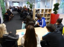 High school students attending a presentation at Sofrecom during an event with Passeport Avenir to discover careers in the digital and tech industry.

