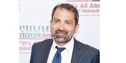 Portrait of Elias Saab, Director of Sofrecom Middle East, at a telecom summit, illustrating his commitment to digital transformation.